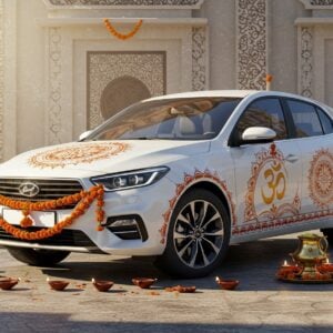 A pristine white modern car adorned with traditional Indian decorative elements, featuring intricate Madhubani-style patterns in gold and saffron along its sides. A prominent brass Om symbol gleams on the hood, while marigold garlands elegantly drape across the front. Crystal hanging accessories with small bells and red threads dangle from the rearview mirror. The car is parked in front of a contemporary temple structure with geometric mandala patterns. Soft morning sunlight creates a divine glow around the vehicle, casting gentle shadows. Small oil lamps (diyas) arranged in a semicircle in front of the car emit a warm golden light. The scene includes subtle smoke trails from incense sticks, creating a mystical atmosphere. The background features a blend of modern architecture with traditional Indian design elements, while maintaining a minimalist aesthetic. Art style combines photorealistic rendering with ethereal lighting and traditional Indian art elements, emphasizing deep maroons, vibrant saffrons, and metallic gold accents.