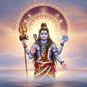 An ethereal depiction of Lord Shiva, Mahadev, standing gracefully on the banks of the serene Ganges River. He has four arms; in one hand, he holds a trident with a damaru drum attached, another holds a crescent moon, a third carries a blue lotus, and the last is open in a blessing gesture. His long, flowing hair cascades down, adorned with river water and flowers. His third eye glows softly on his forehead, radiating divine wisdom. The backdrop features a surreal, glowing mandala in gold and deep maroon, symbolizing spiritual enlightenment. The tranquil atmosphere is accentuated by misty clouds and soft pastel lights that illuminate the scene with a warm, golden glow. Traditional motifs like delicate patterns of lotus flowers and intricate Indian designs frame the composition. The overall tone is serene and spiritually uplifting, inviting viewers to deepen their connection with Mahadev through the sacred Rudrabhishek Puja.