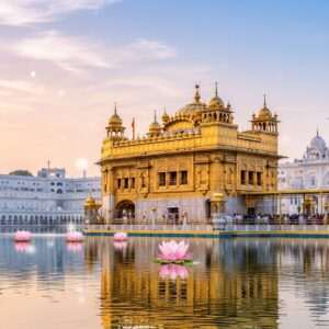 An ethereal depiction of the Golden Temple, its luminous golden façade reflecting softly on the calm water surrounding it. The intricate architectural details are highlighted, showcasing the temple's ornate carvings and golden domes against a backdrop of a serene pastel sky at dawn, with hues of pale pink and soft blue. Gentle glowing lights accentuate the temple's spiritual ambiance, while large, stylized lotus flowers float on the water's surface, symbolizing purity and tranquility. The scene embodies a balance of heritage and modern digital aesthetics, inviting viewers to delve into the splendor and history of this sacred site.